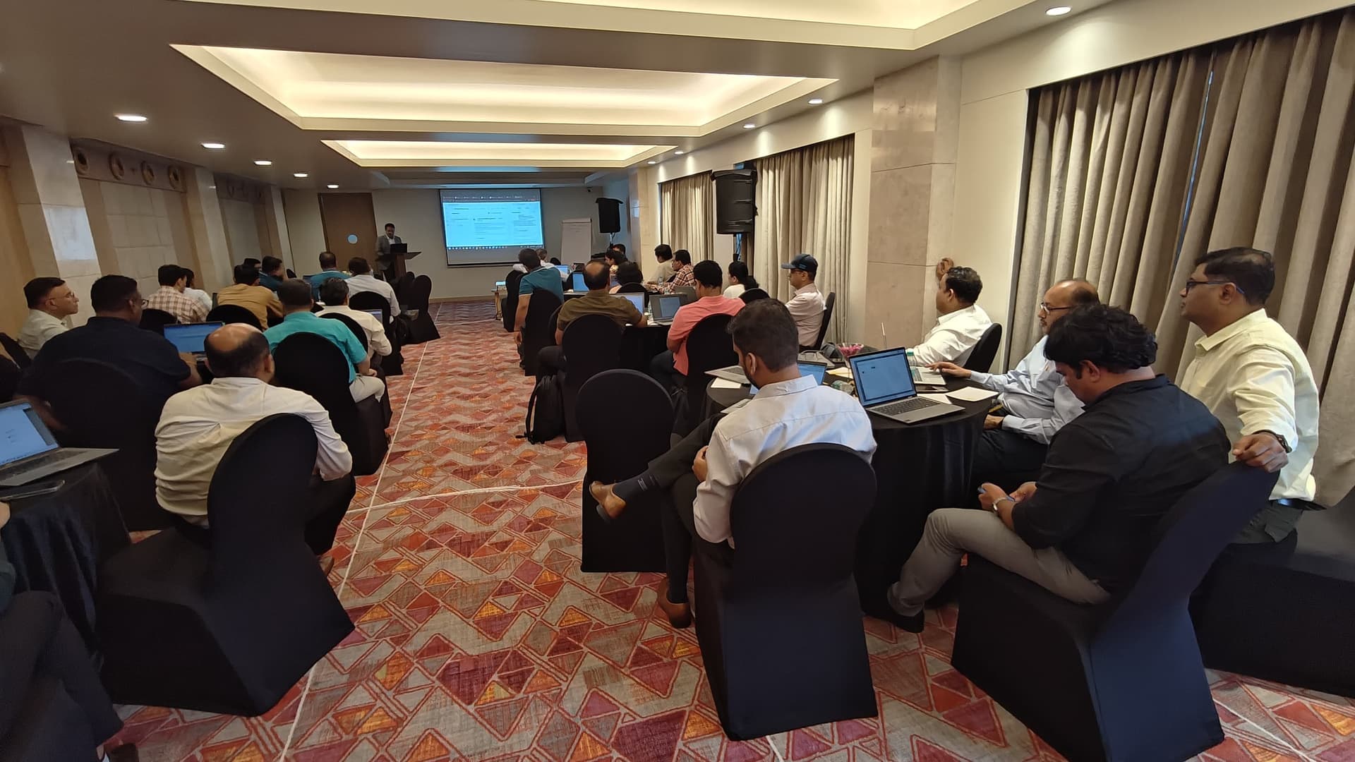 Enterprise teams collaborating in a practical AI workshop — program highlight 2