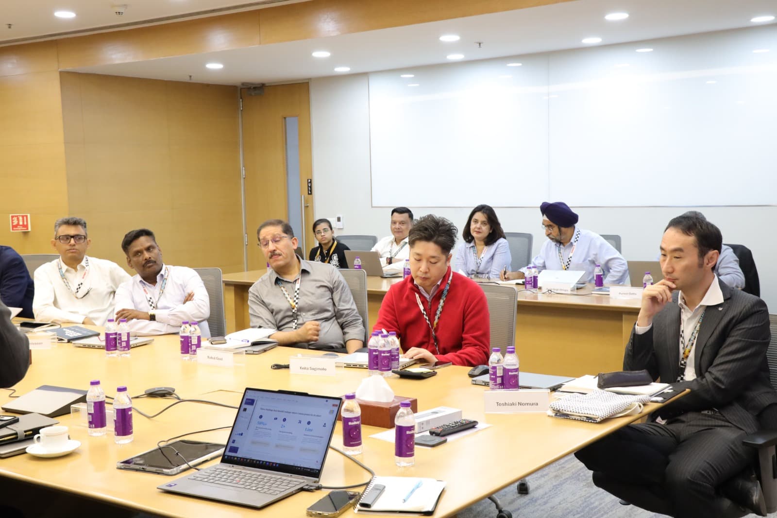Enterprise teams collaborating in a practical AI workshop — program highlight 8