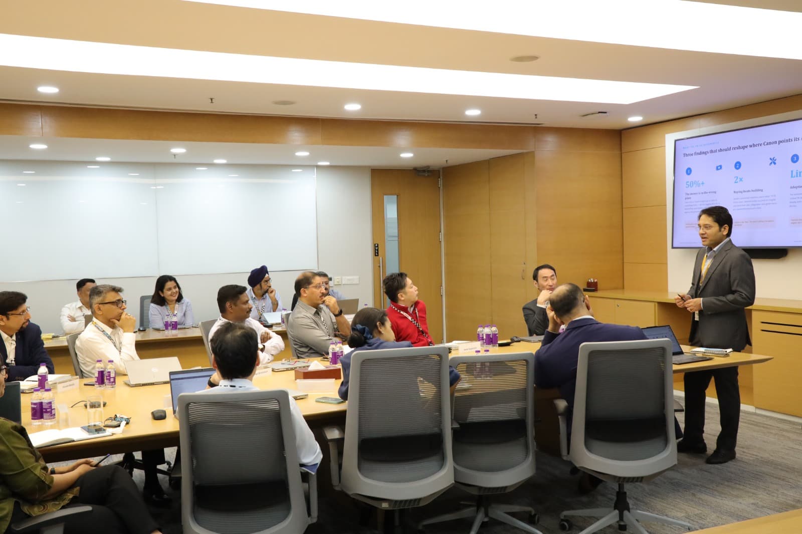 Enterprise teams collaborating in a practical AI workshop — program highlight 10